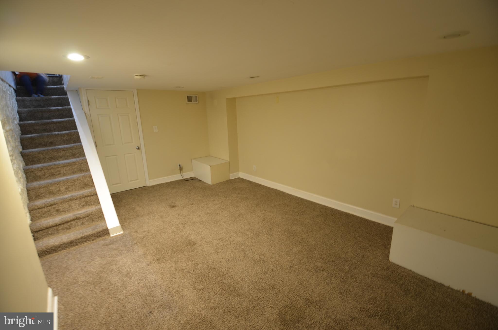 26 North E Avenue Baltimore, MD 21224 - Photo 3 of 22 a view of an empty room with stairs