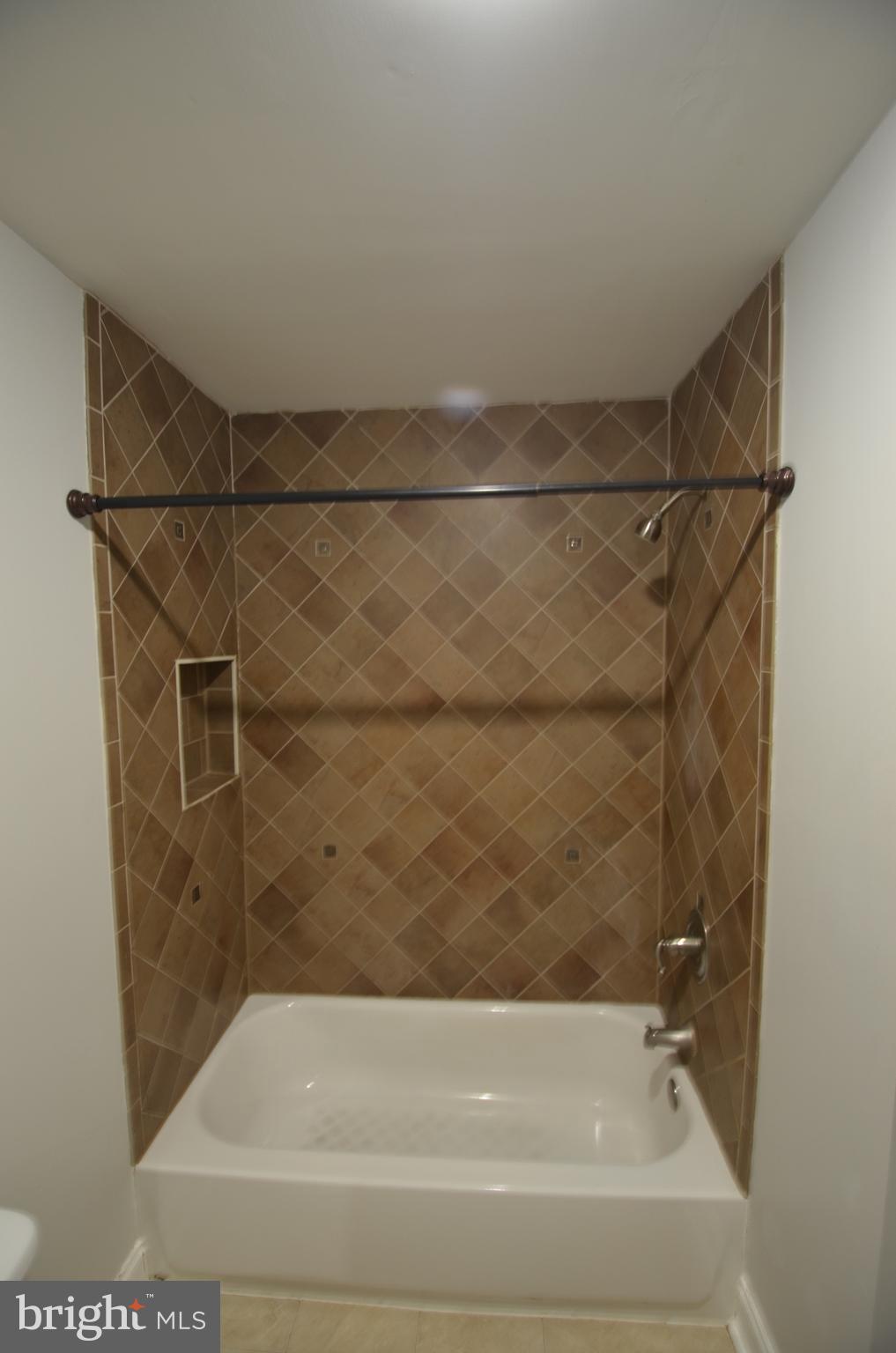 26 North E Avenue Baltimore, MD 21224 - Photo 9 of 22 a bathroom with a shower and a bath tub