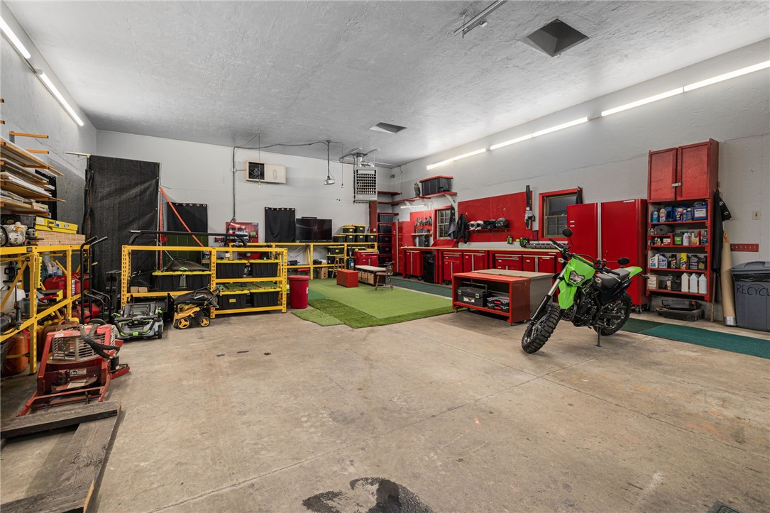 365 West Wrentham Road Cumberland, RI 02864 - Photo 44 of 50 Huge 1200 SF heated garage. 250,000 BTW propone heater under 5 years old. Lots of workshop storage can remain.