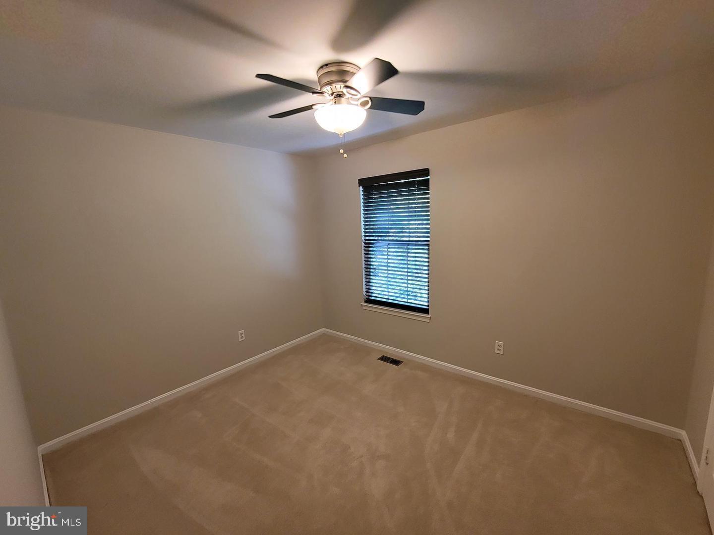 4788 Pearson Drive Woodbridge, VA 22193 - Photo 13 of 23 an empty room with windows and fan