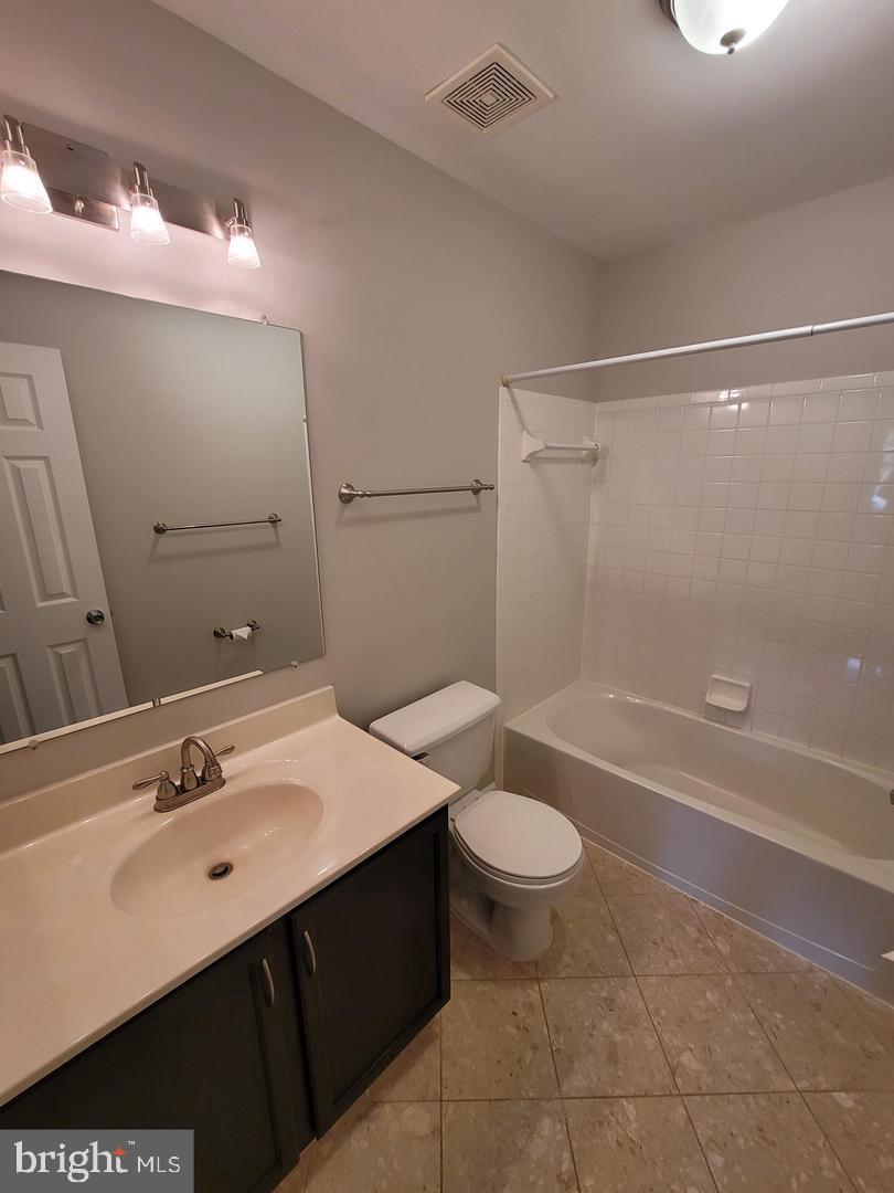 4788 Pearson Drive Woodbridge, VA 22193 - Photo 15 of 23 a bathroom with a sink a toilet and shower