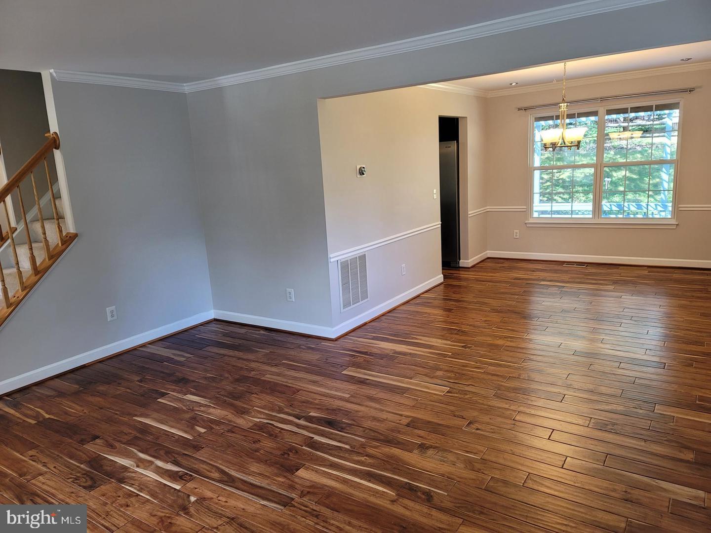 4788 Pearson Drive Woodbridge, VA 22193 - Photo 2 of 23 a view of an empty room with wooden floor and a window