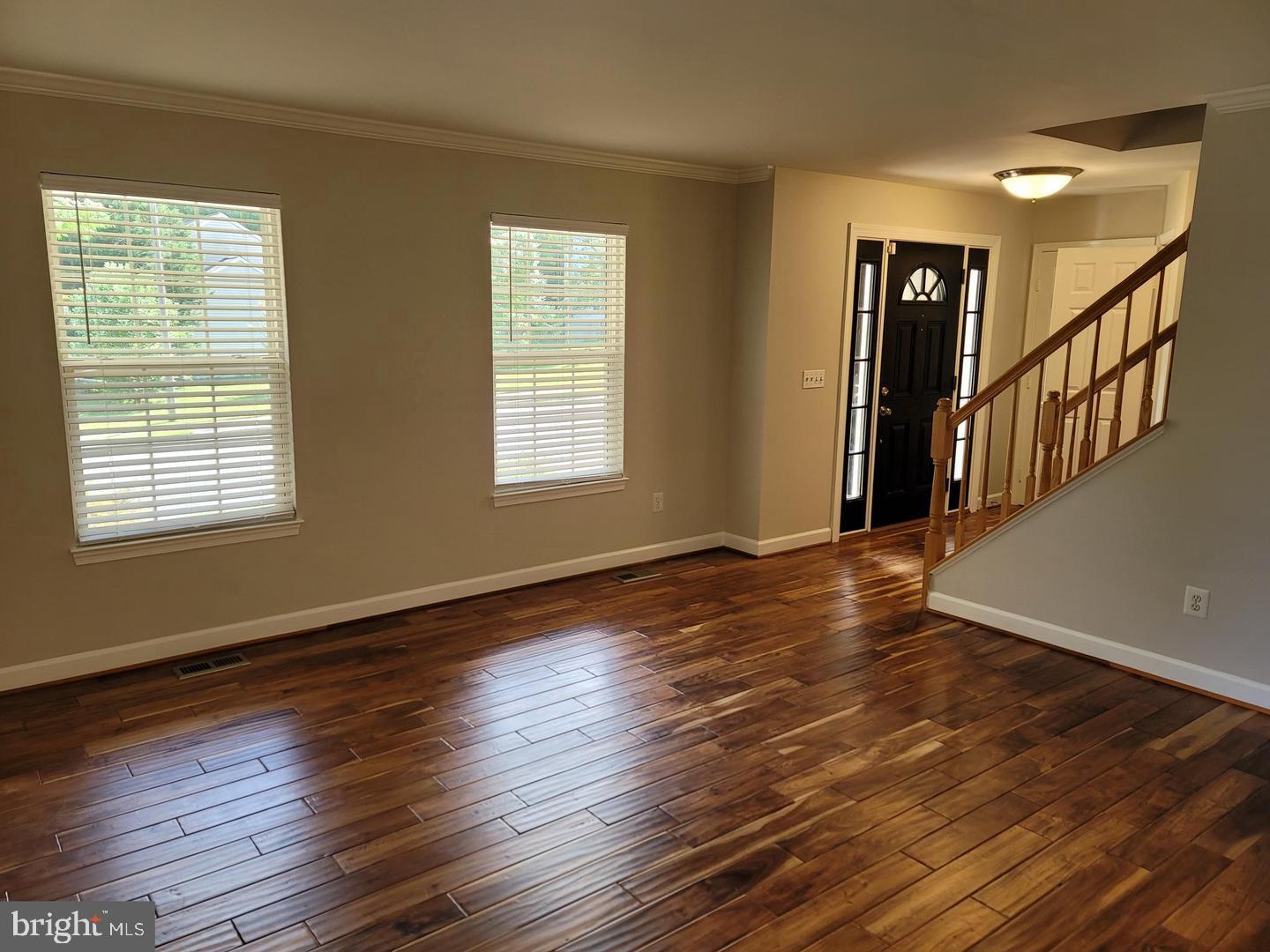 4788 Pearson Drive Woodbridge, VA 22193 - Photo 3 of 23 a view of an empty room with wooden floor and a window
