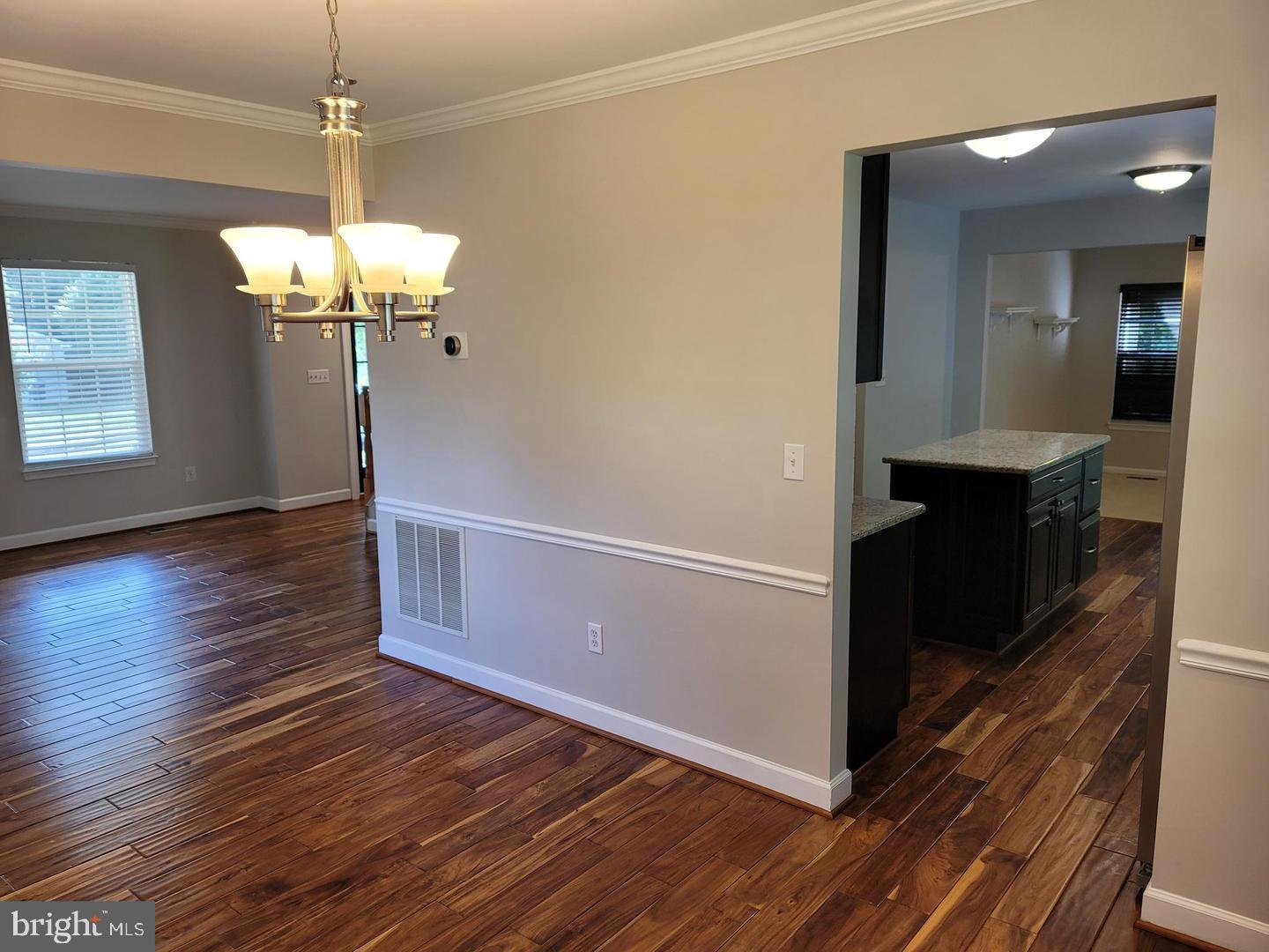 4788 Pearson Drive Woodbridge, VA 22193 - Photo 5 of 23 a view of a room with wooden floor and chandelier