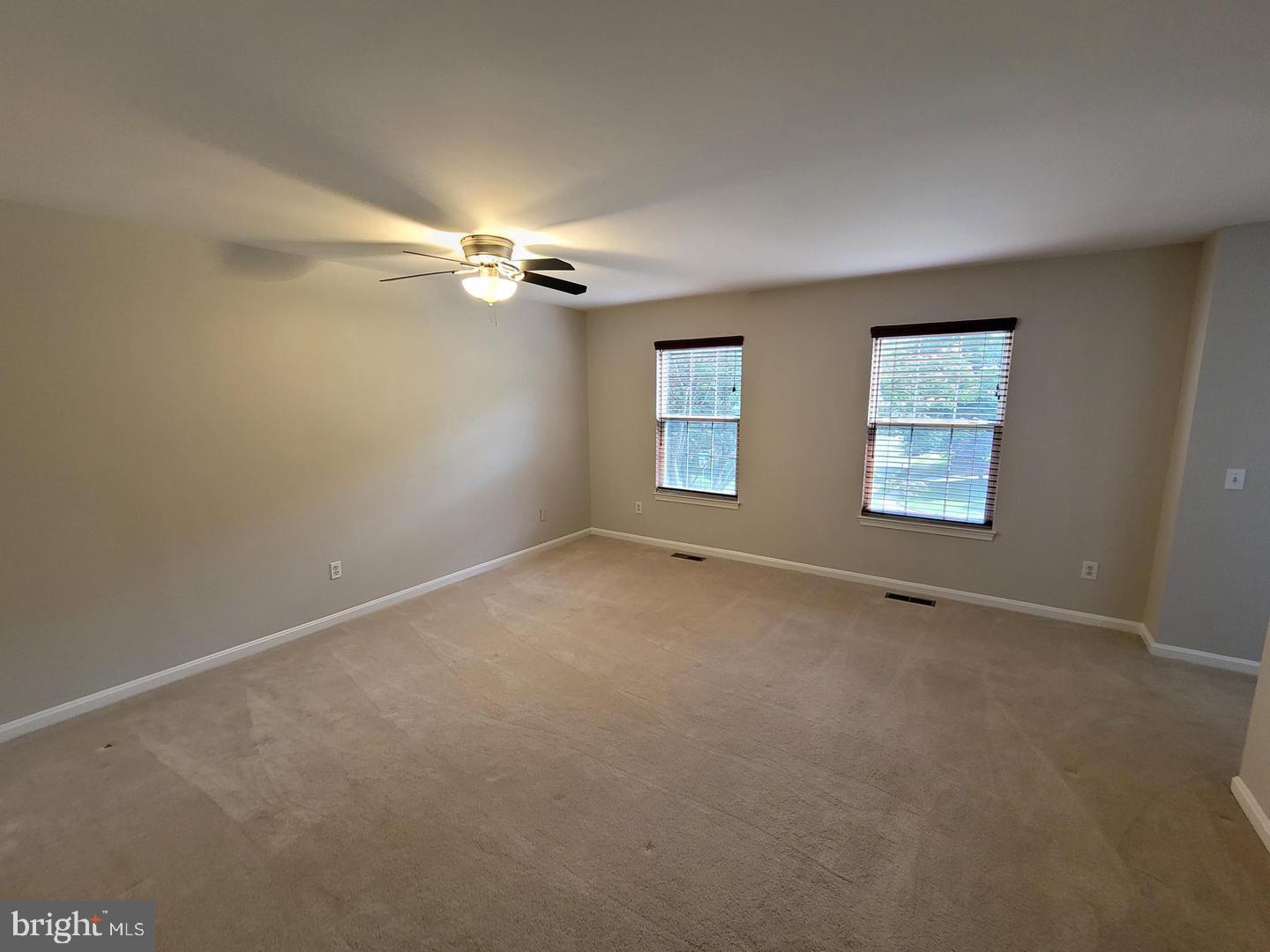 4788 Pearson Drive Woodbridge, VA 22193 - Photo 10 of 23 an empty room with windows and fan