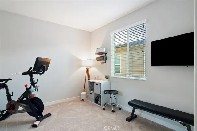 a room with gym equipment and a window