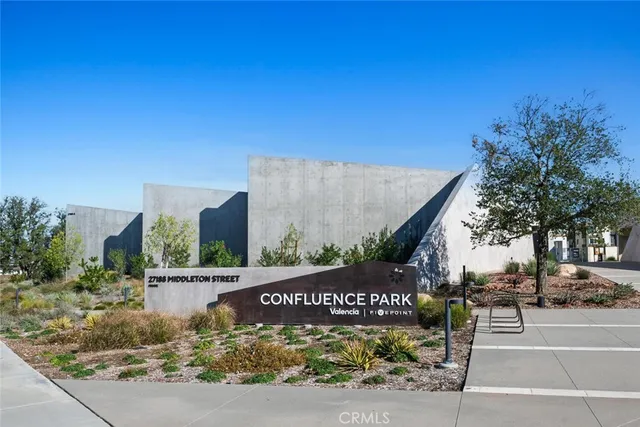 a view of a park with a car parked on the side of it