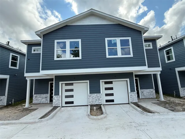 a front view of a house with parking space