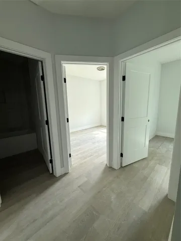 an empty room with wooden door