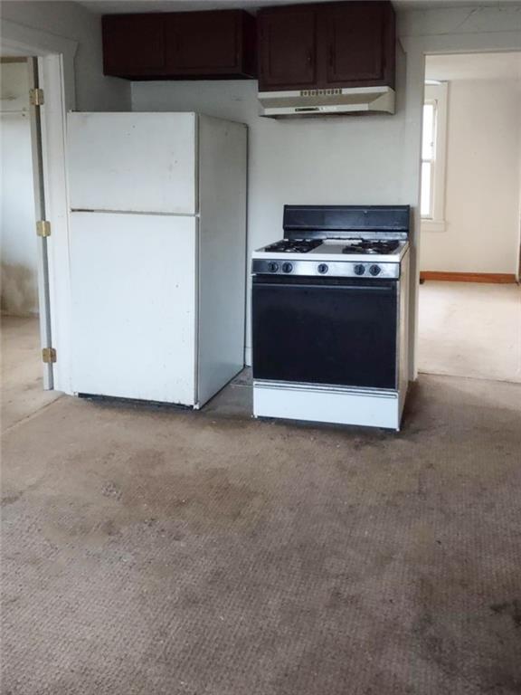 3009 Old Pittsburgh Road New Castle, PA 16101 - Photo 2 of 8 a kitchen with a stove and a microwave
