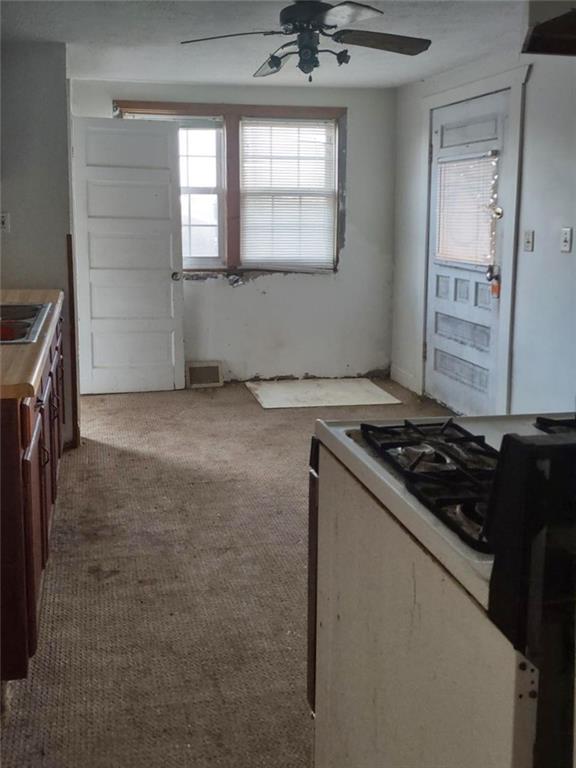 3009 Old Pittsburgh Road New Castle, PA 16101 - Photo 3 of 8 a kitchen with a stove and a window