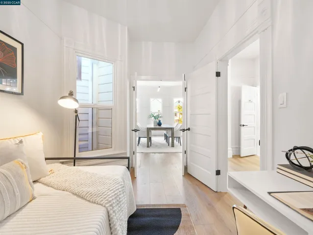 a large white bed in a white room