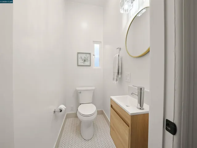 a white toilet sitting next to a bathroom sink