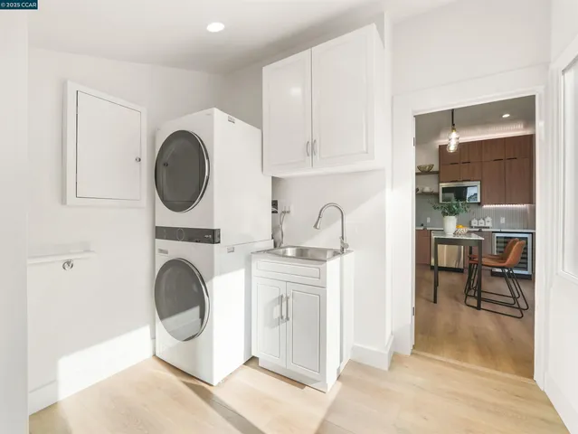 a living room with furniture a clock and a view of living room