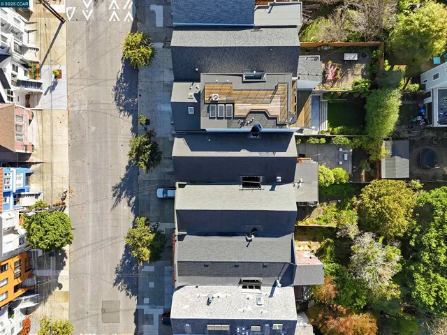 an aerial view of a houses with yard