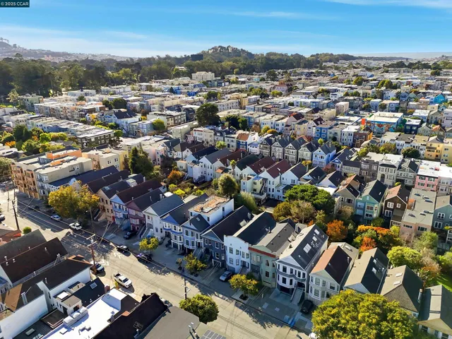an aerial view of a city with lots of residential buildings