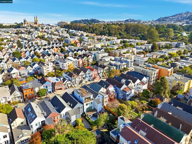 an aerial view of a city with lots of residential buildings