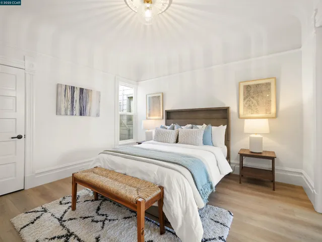 a bedroom with a bed and a table