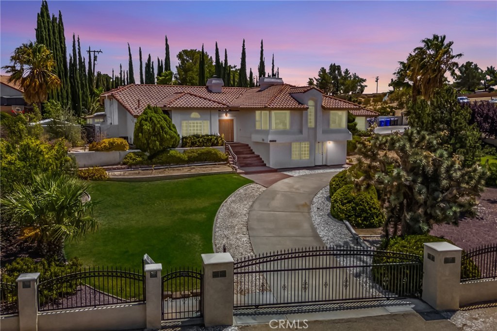 20003 Waco Road Apple Valley, CA 92308 - Photo 1 of 1 a front view of a house with garden