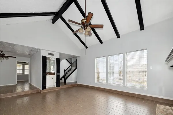 a view of an entryway with wooden floor