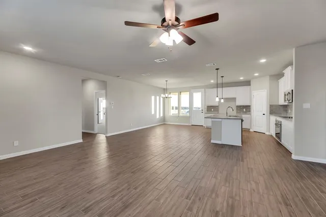 a view of kitchen with wooden floor and window