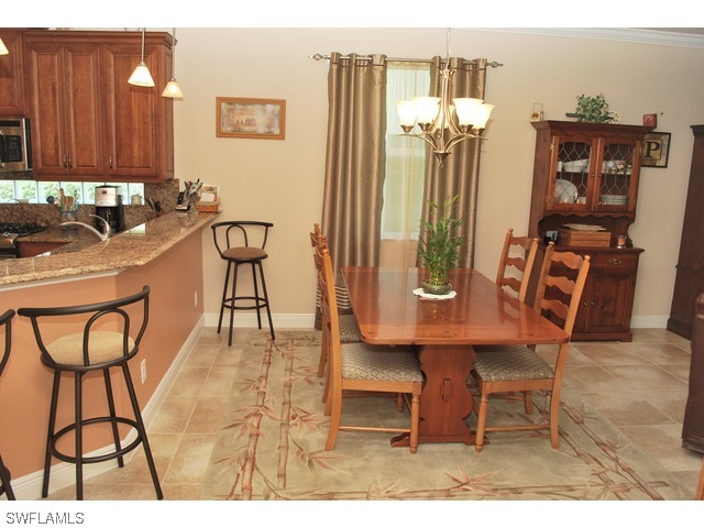 19612 Tesoro Way Fort Myers, FL 33967 - Photo 5 of 14 a balcony with table and chairs