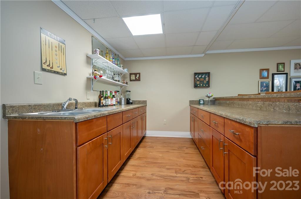 481 Plantation Drive Rutherfordton, NC 28139 - Photo 12 of 48 a kitchen with granite countertop a sink and cabinets