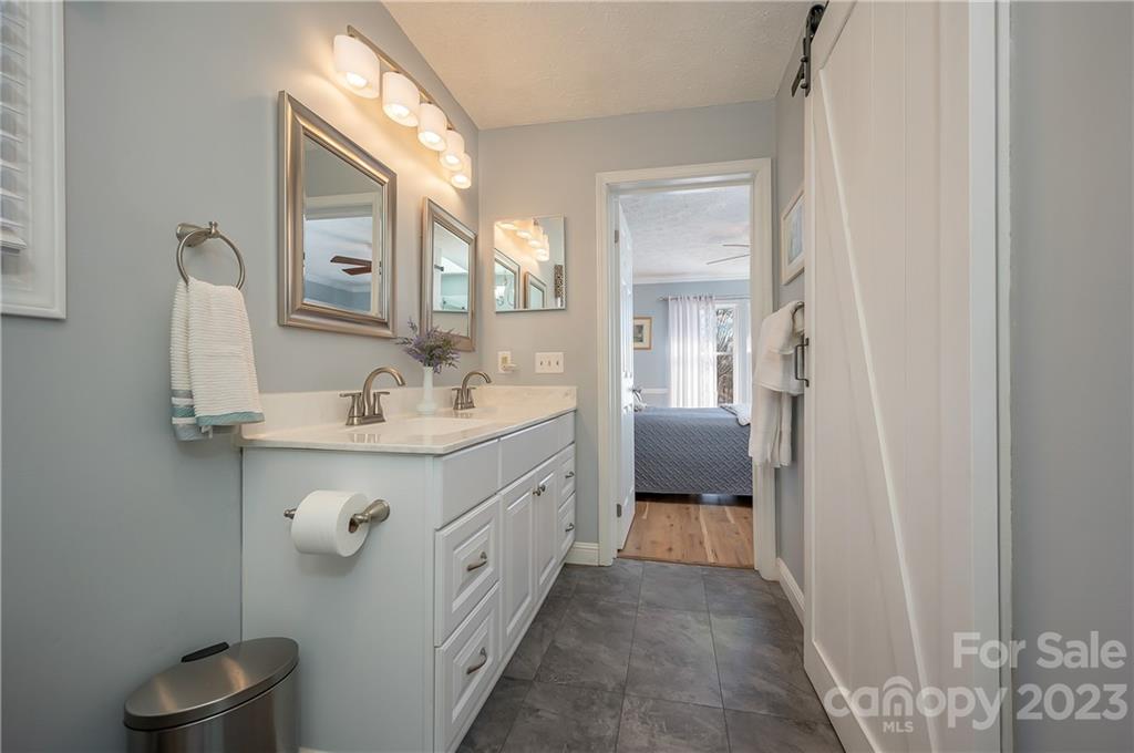 481 Plantation Drive Rutherfordton, NC 28139 - Photo 23 of 48 a spacious bathroom with a double vanity sink and a mirror