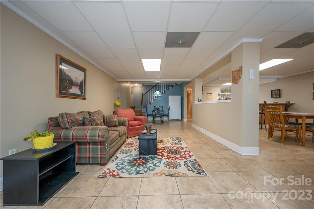 481 Plantation Drive Rutherfordton, NC 28139 - Photo 28 of 48 a living room with furniture and a dining table with kitchen view