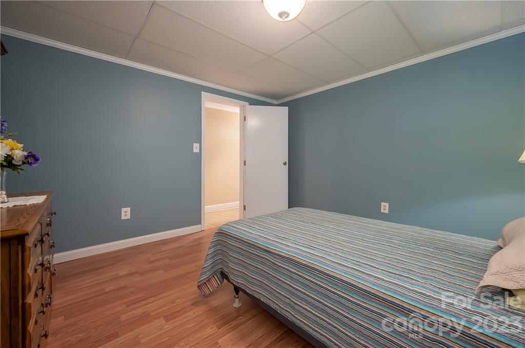 481 Plantation Drive Rutherfordton, NC 28139 - Photo 35 of 48 a bedroom with a bed and a potted plant