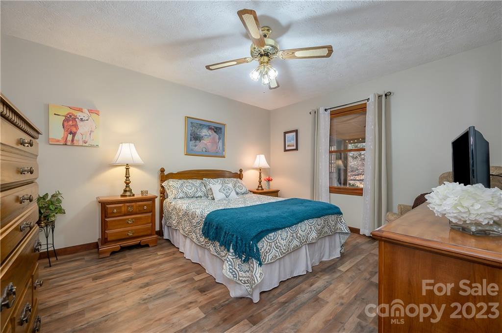481 Plantation Drive Rutherfordton, NC 28139 - Photo 8 of 48 a bedroom with a bed and wooden floor