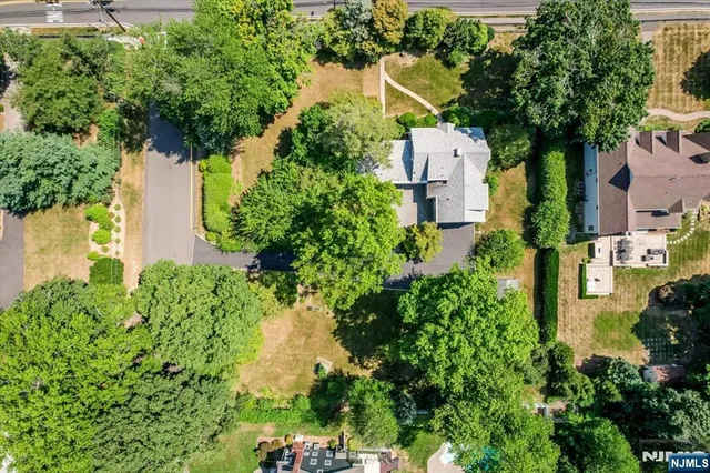 an aerial view of multiple houses with yard