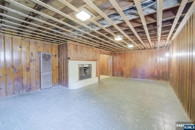a view of an empty room with a fireplace