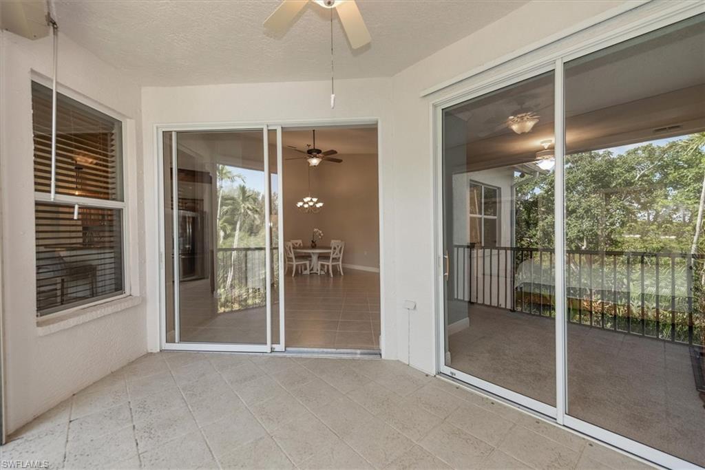 8375 Whisper Trace Way, Unit M203 Naples, FL 34114 - Photo 20 of 36 a view of backyard with balcony