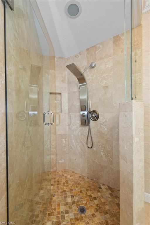 8375 Whisper Trace Way, Unit M203 Naples, FL 34114 - Photo 23 of 36 a bathroom with a shower
