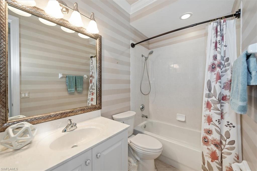 8375 Whisper Trace Way, Unit M203 Naples, FL 34114 - Photo 27 of 36 a bathroom with a sink toilet tub and shower