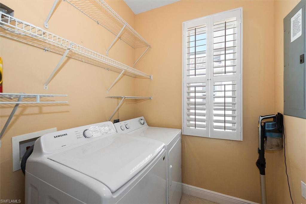 8375 Whisper Trace Way, Unit M203 Naples, FL 34114 - Photo 30 of 36 a utility room with dryer and washer