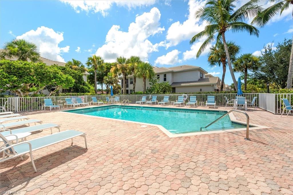 8375 Whisper Trace Way, Unit M203 Naples, FL 34114 - Photo 32 of 36 a view of swimming pool is middle in the garden