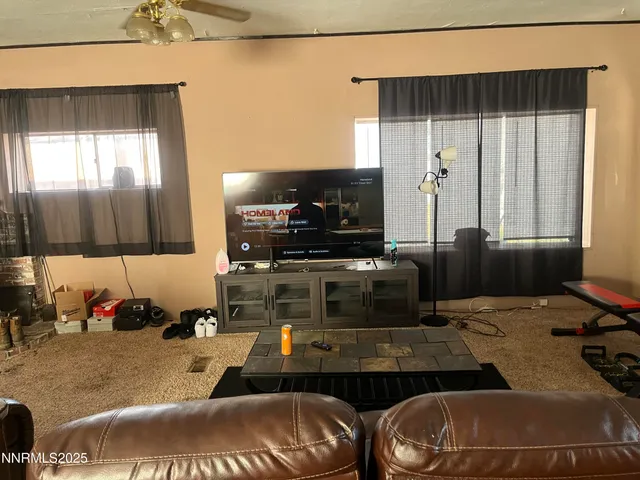 a kitchen with a table chairs and a refrigerator