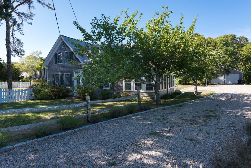 316 Lower County Road Harwich, MA 02646 - Photo 1 of 29 a view of house with yard and green space