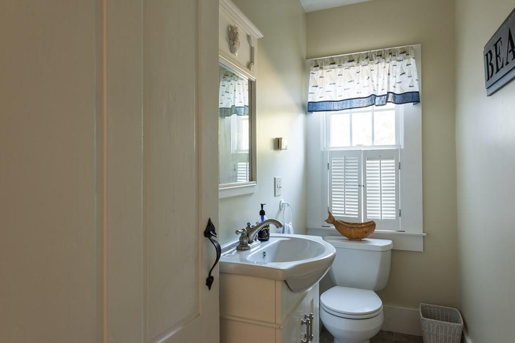 316 Lower County Road Harwich, MA 02646 - Photo 23 of 29 a bathroom with a toilet a sink and a window