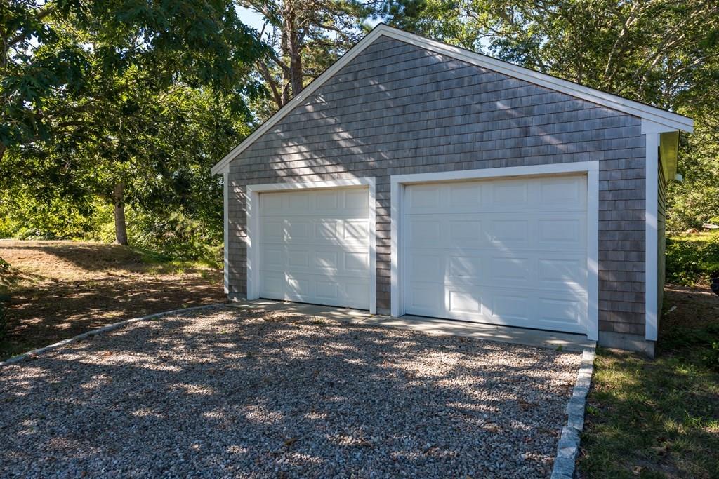 316 Lower County Road Harwich, MA 02646 - Photo 3 of 29 a backyard of house with garage