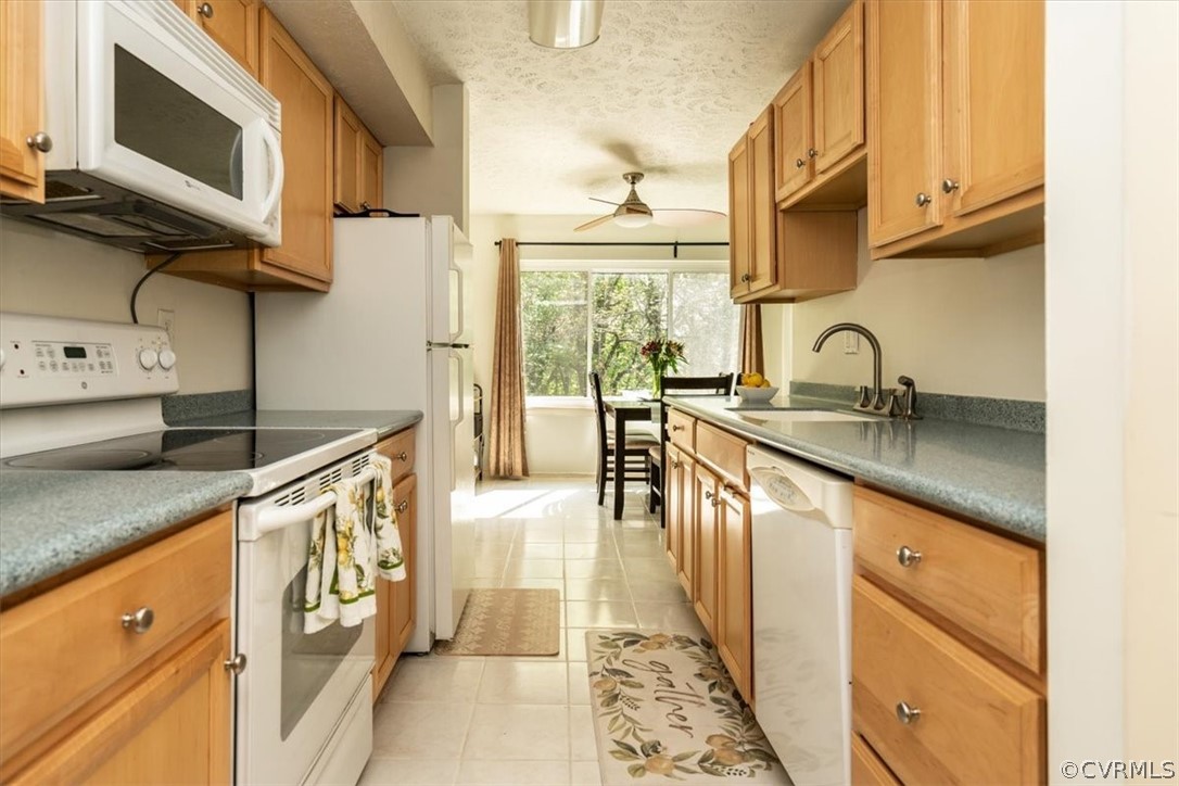 1507 Largo Road, Unit 303 Henrico, VA 23238 - Photo 12 of 40 Kitchen with white appliances, tile floors, ceilin