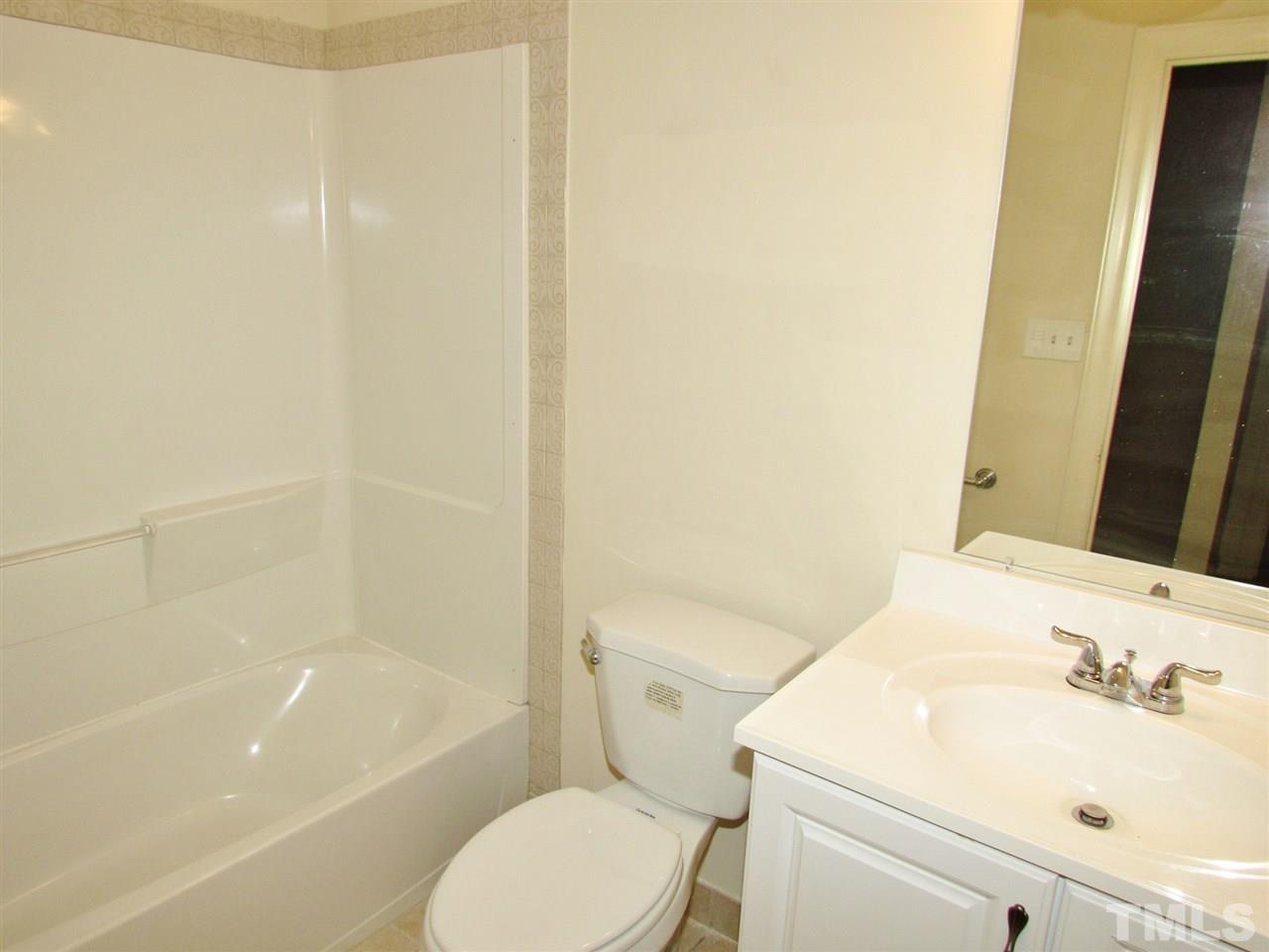 212 Dunstable Court Raleigh, NC 27614 - Photo 18 of 25 a bathroom with a sink and a toilet