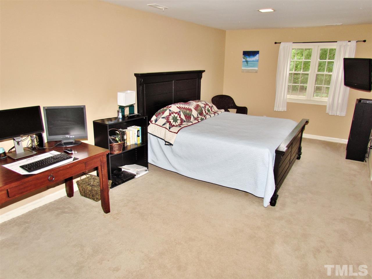 212 Dunstable Court Raleigh, NC 27614 - Photo 19 of 25 a bedroom with a bed and wooden floor