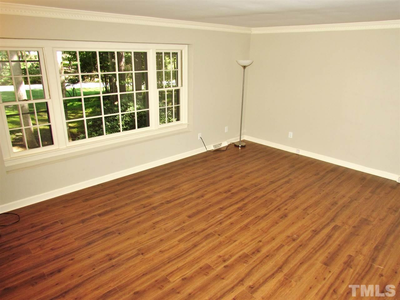 212 Dunstable Court Raleigh, NC 27614 - Photo 5 of 25 a view of empty room with wooden floor and fan