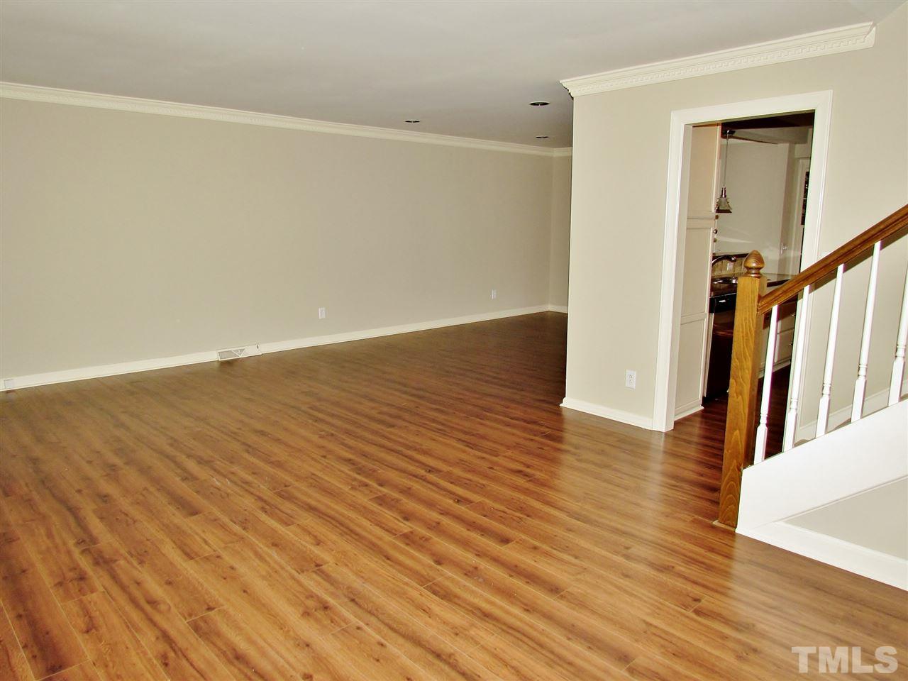 212 Dunstable Court Raleigh, NC 27614 - Photo 6 of 25 a view of a room with wooden floor and staircase