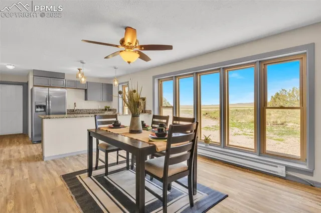 a view of a dining room with furniture window and wooden floor