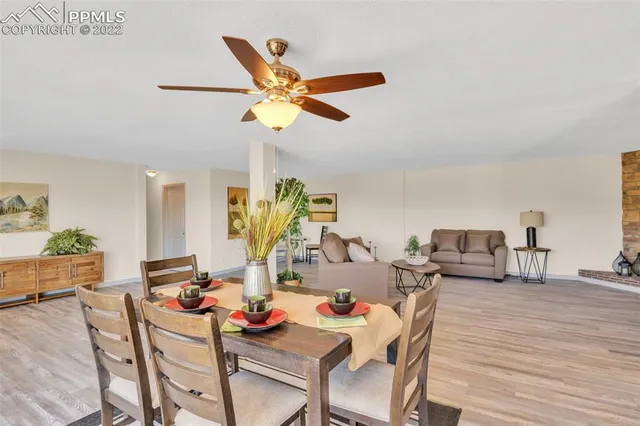 a view of a dining room with furniture and wooden floor