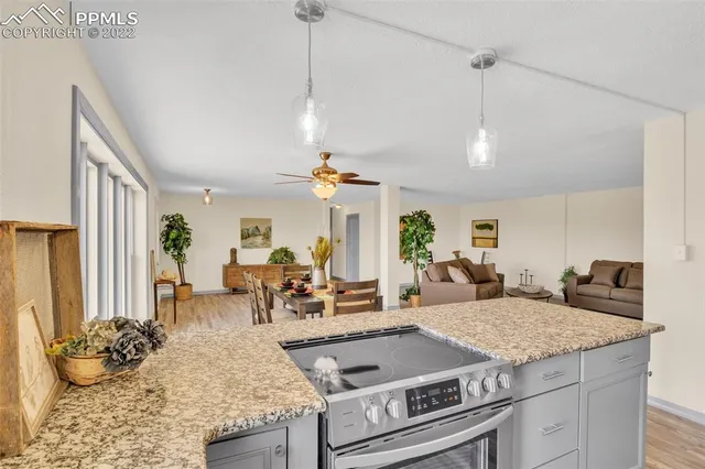 a view of a living room and kitchen